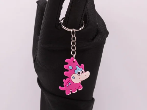 Adorable Porte-clés Dinosaure Rose : Un Compagnon Préhistorique et Coloré !