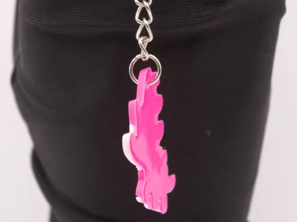 Adorable Porte-clés Dinosaure Rose : Un Compagnon Préhistorique et Coloré !