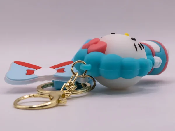 Adorable porte-clés Hello Kitty bleu et tablier, nœud rose en plastique