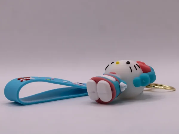 Adorable porte-clés Hello Kitty bleu et tablier, nœud rose en plastique