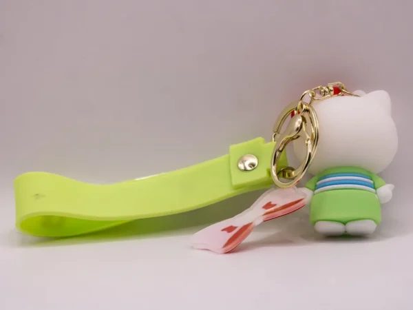 Adorable porte-clés Hello Kitty en kimono vert avec nœud rouge