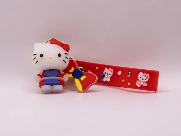 Adorable porte-clés Hello Kitty rouge et violet avec nœud rouge
