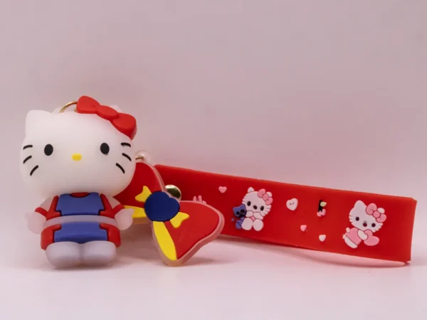Adorable porte-clés Hello Kitty rouge et violet avec nœud rouge