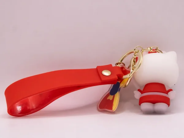 Adorable porte-clés Hello Kitty rouge et violet avec nœud rouge