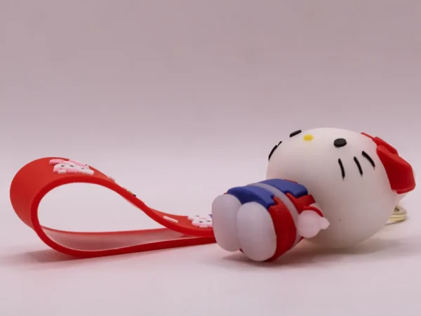 Adorable porte-clés Hello Kitty rouge et violet avec nœud rouge