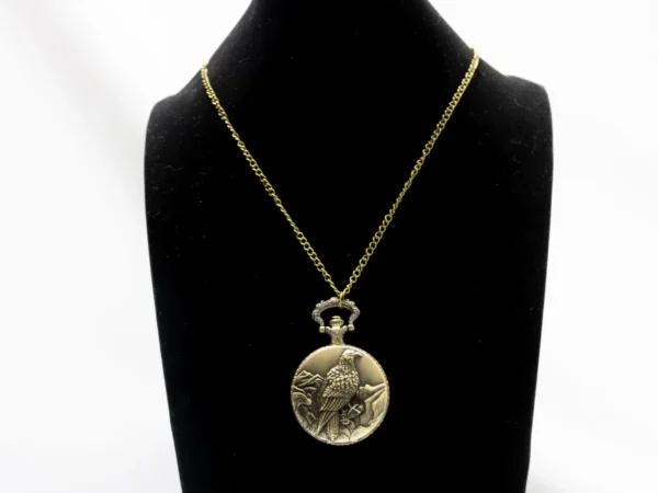Collier montre à gousset dorée vintage avec motif aigle royal