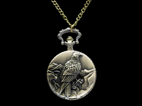 Collier montre à gousset dorée vintage avec motif aigle royal