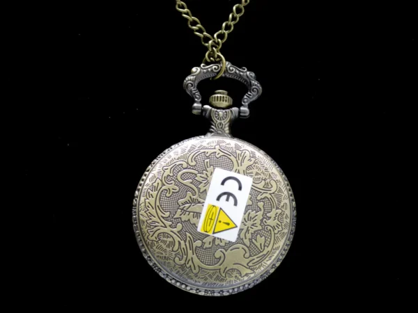 Collier montre à gousset dorée vintage avec motif aigle royal