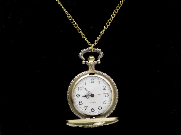 Collier montre à gousset dorée vintage avec motif aigle royal