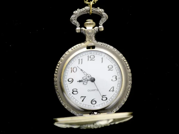 Collier montre à gousset dorée vintage avec motif aigle royal