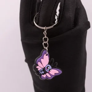 Papillon décoratif violet, rose et noir en plastique