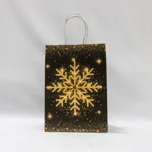 Petit sac cadeau de Noël noir orné de flocons de neige dorés