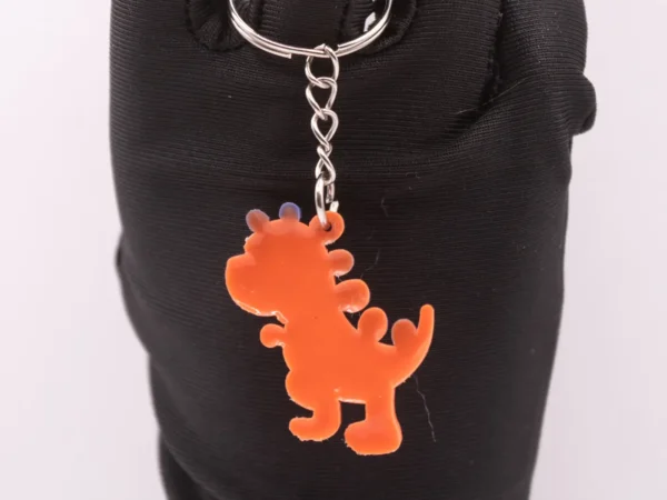 Porte-clés Dinosaure Orange et Violet - Accessoire Préhistorique Fun