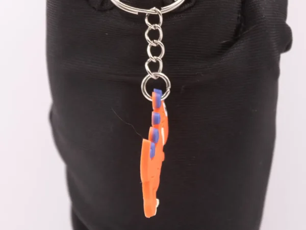 Porte-clés Dinosaure Orange et Violet - Accessoire Préhistorique Fun