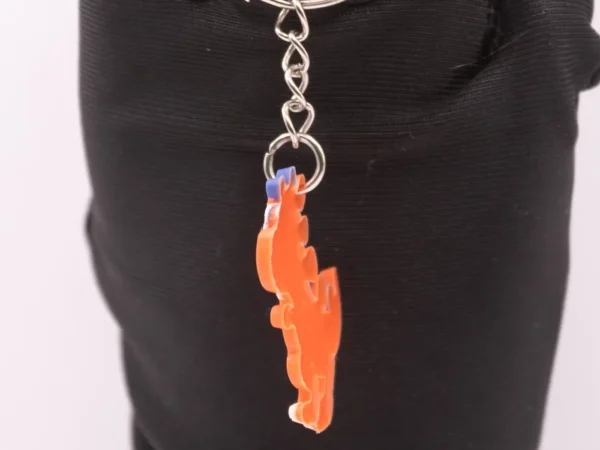 Porte-clés Dinosaure Orange et Violet - Accessoire Préhistorique Fun