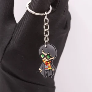 Porte-clés Harry Potter et sa baguette magique en plastique blanc