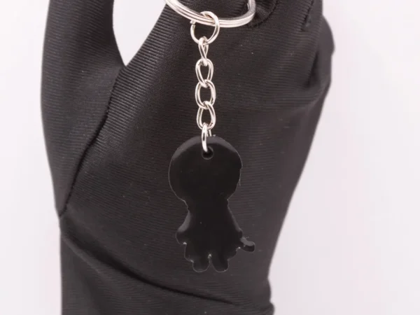 Porte-clés Harry Potter et sa baguette magique en plastique blanc