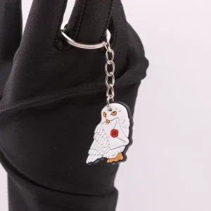 Porte-clés Harry Potter : Hedwige et son enveloppe, un accessoire magique en plastique blanc