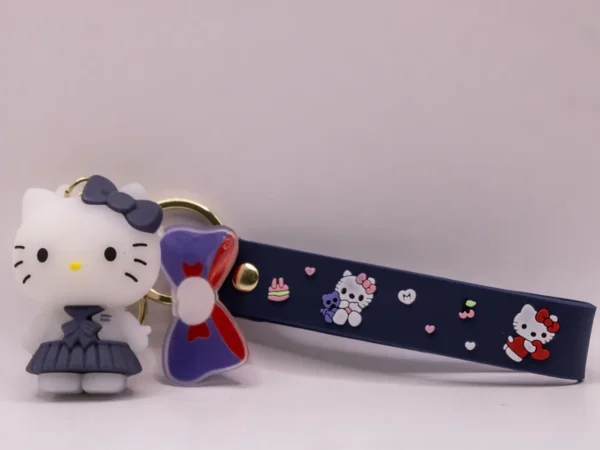 Porte-clés Hello Kitty en uniforme scolaire gris et nœud gris