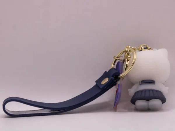 Porte-clés Hello Kitty en uniforme scolaire gris et nœud gris